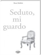 Seduto, mi guardo